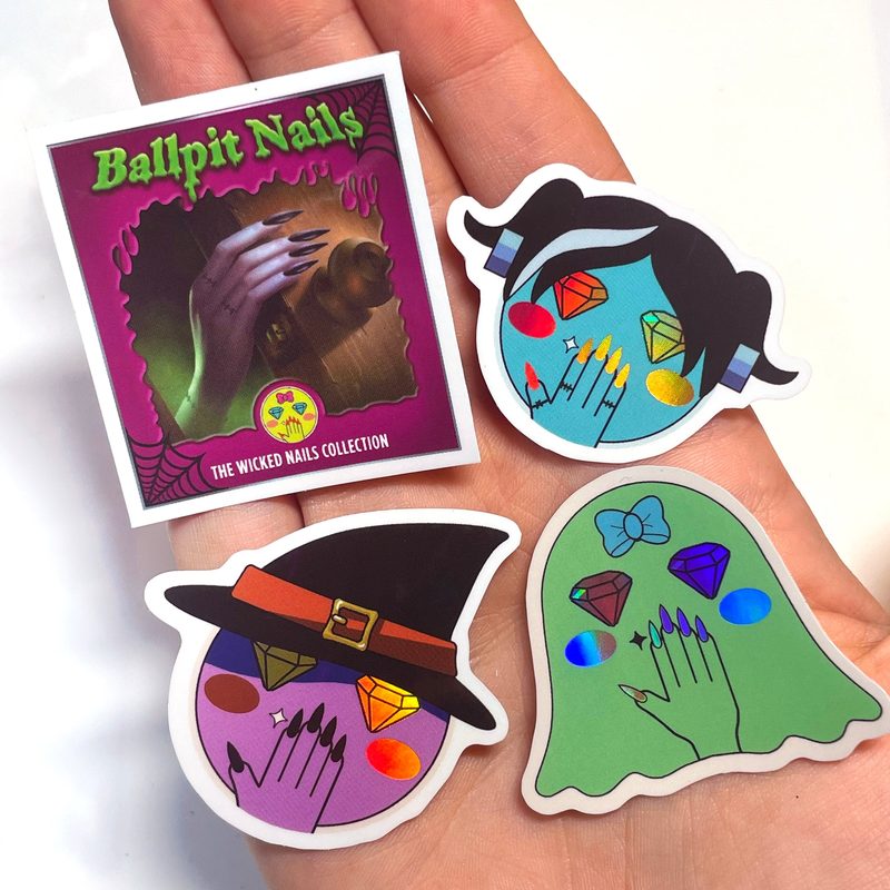 close-up of popular Halloween nail art sticker designs including pumpkins and bats