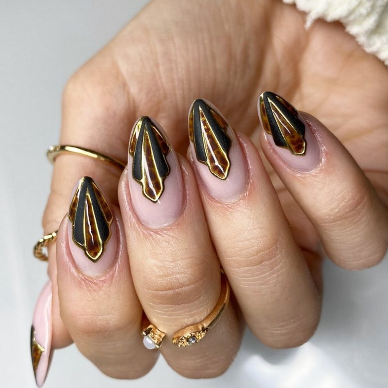 close-up of vintage art deco nail designs showing geometric patterns