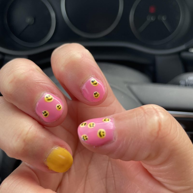 customer consulting with nail technician about nail art services