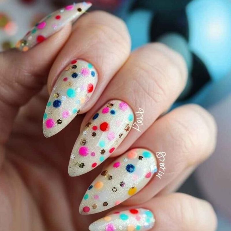 detailed creative nail art design with floral and rhinestone accents