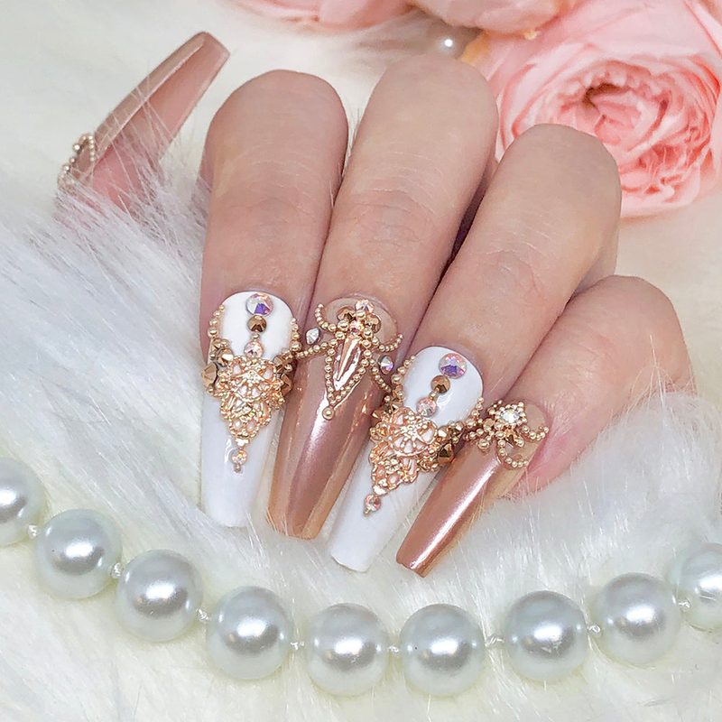 elegant manicure with sparkling nail art and caviar beads suited for special occasions
