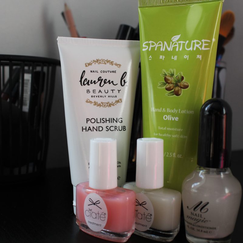 Hands applying cuticle oil as part of nail care to maintain manicure