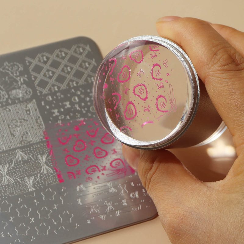 nail art stamping tools transferring intricate patterns onto nails