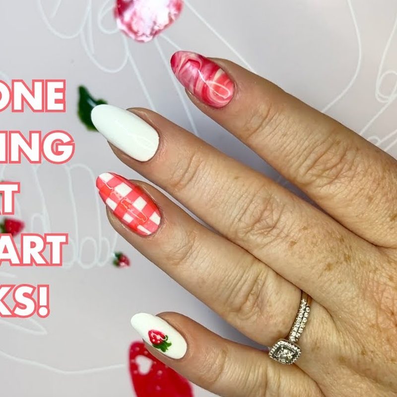 nail artist mixing colors and using brushes on a mat for nail art