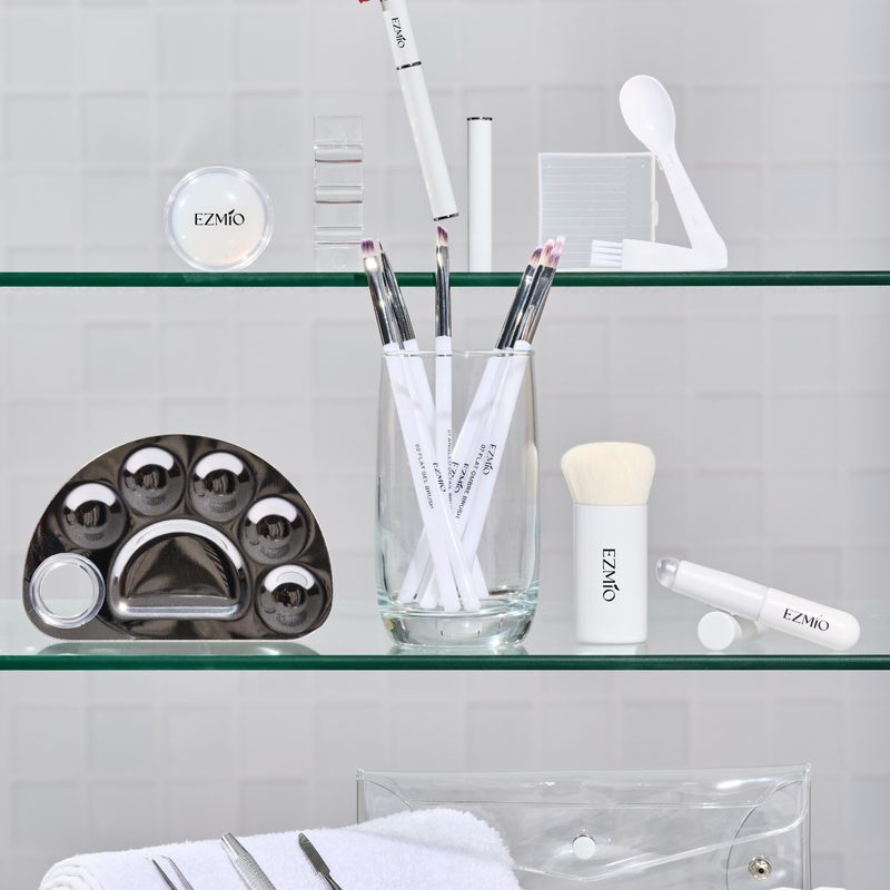 professional nail art tools including brushes and curing lamp