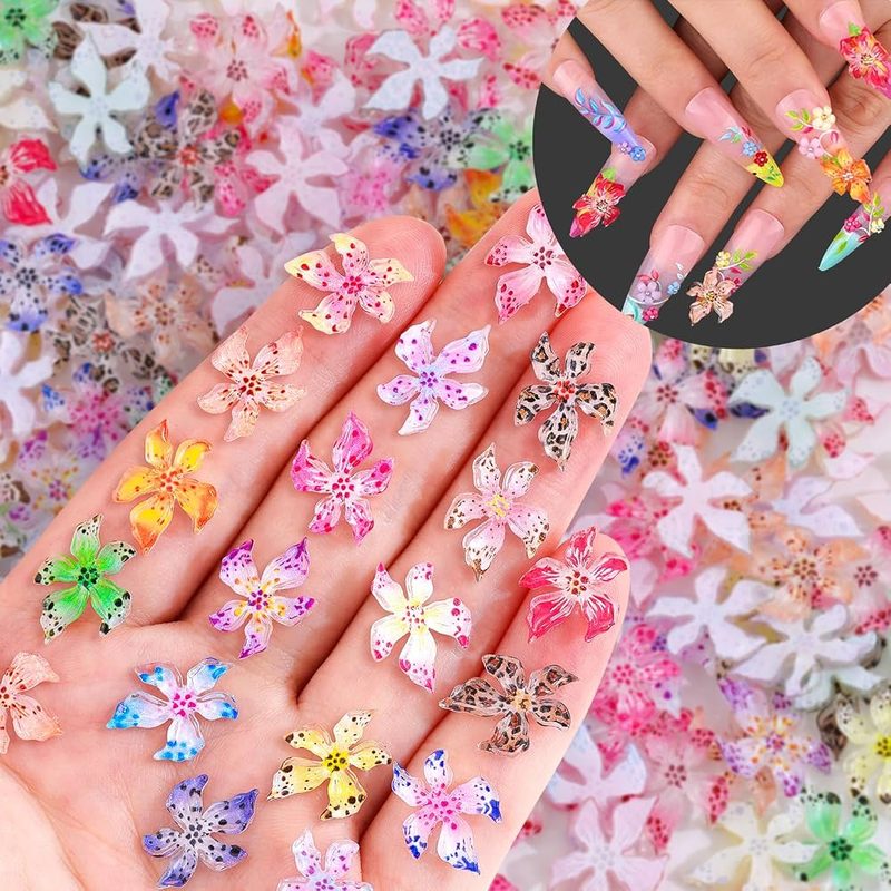 trendy nail art featuring caviar beads and charms with nail art paint accents