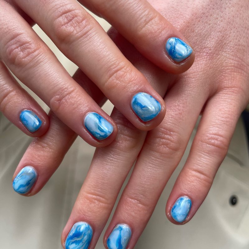 variety of creative gel pen nail art designs on nails