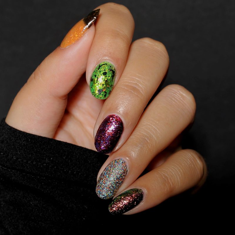 variety of nail art brushes and tools laid out for black nail polish designs