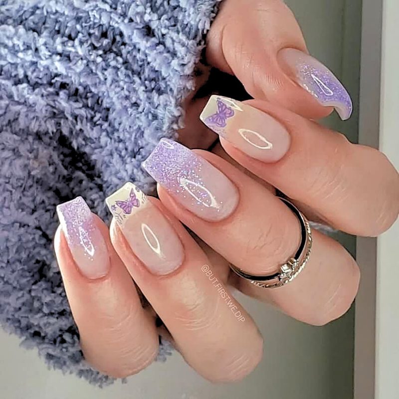 various nail art styles including hand-painted and rhinestone designs
