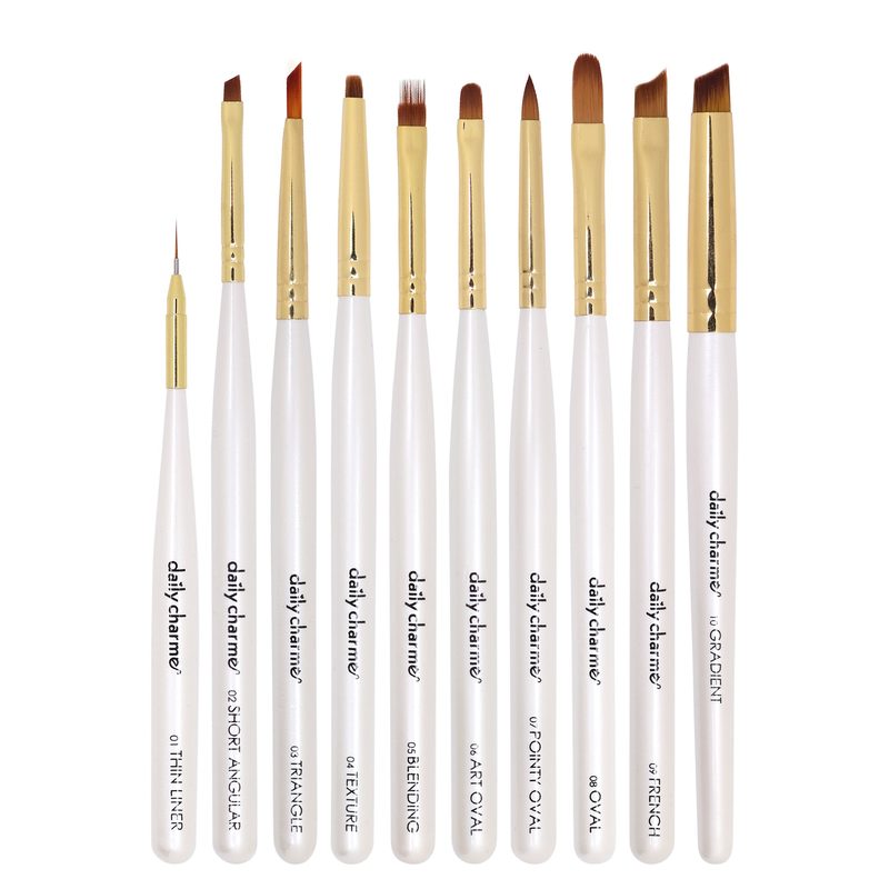 various professional nail art paint brushes arranged on a white background