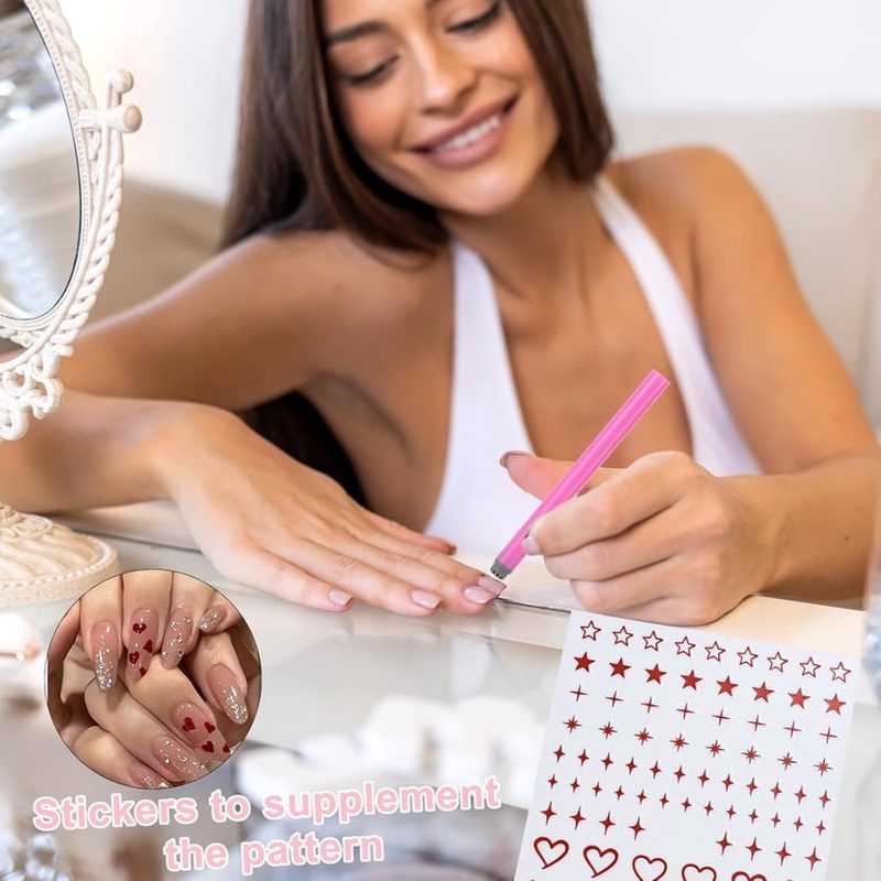 Woman applying delicate nail art stamping designs using a nail art stamping pen